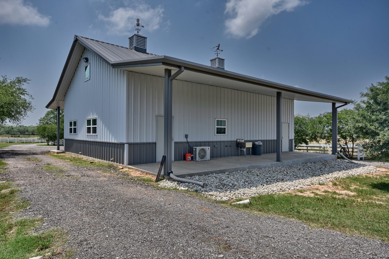 Covered porch underside showing flush-mounted purlins, full soffit and tube columns