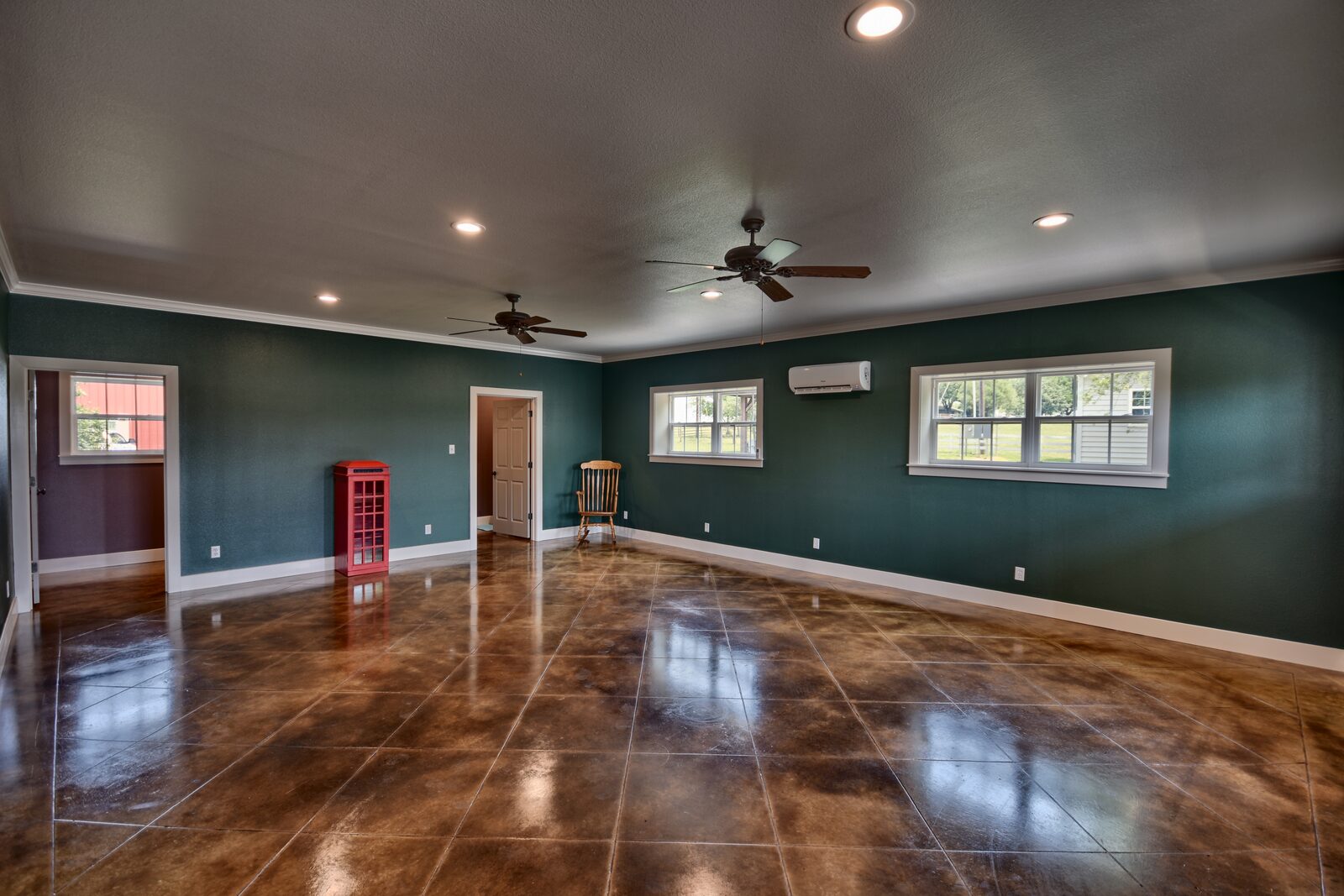Game room from the opposite corner showing doorways through to the rest of the building